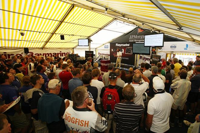 Attracting a crowd for the all-important Raymarine Weather Briefing, Chris Tibbs addresses a packed ISC marquee - 2016 J.P. Morgan Asset Management Round the Island Race © Patrick Eden